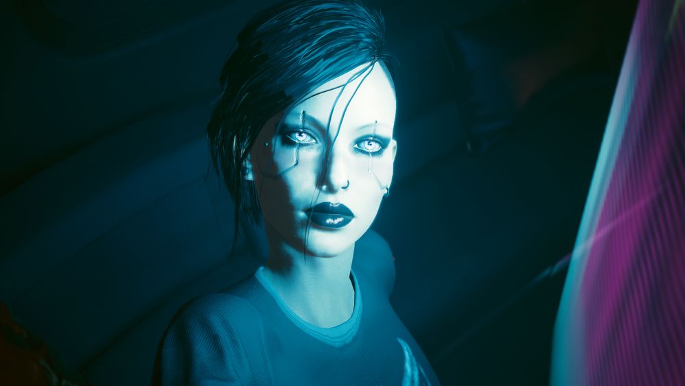 A close up image of a female character with black hair and a white blue light