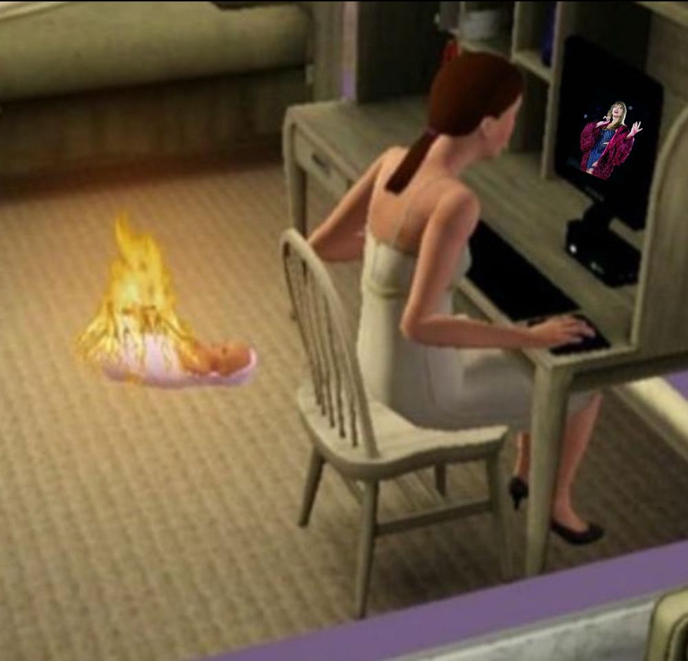 An adult sim on the computer with Taylor Swift during the Midnights Era. There is a sim baby on fire behind the adult sim. 
