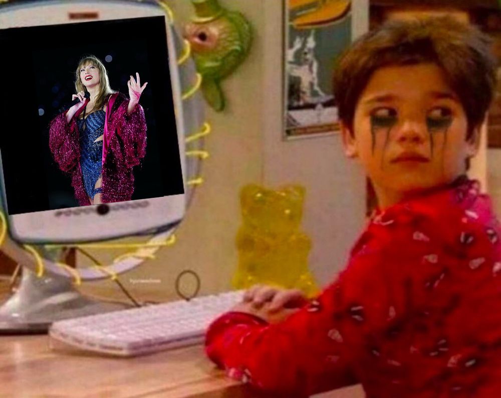 Freddie from ICarly with running mascara at a computer that shows Taylor during Karma on the Eras Tour.