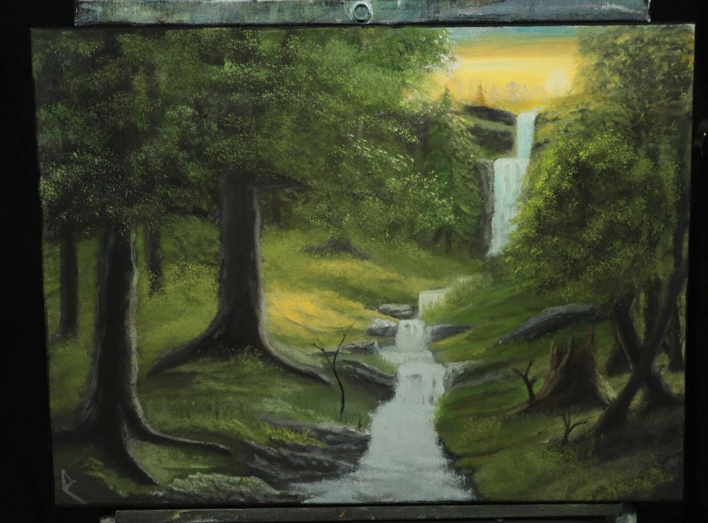“Sunset Falls”, an 18”x24” oil painting of a sunset over a waterfall, with a stream cutting through a sunlit forest and heavy shadows.  