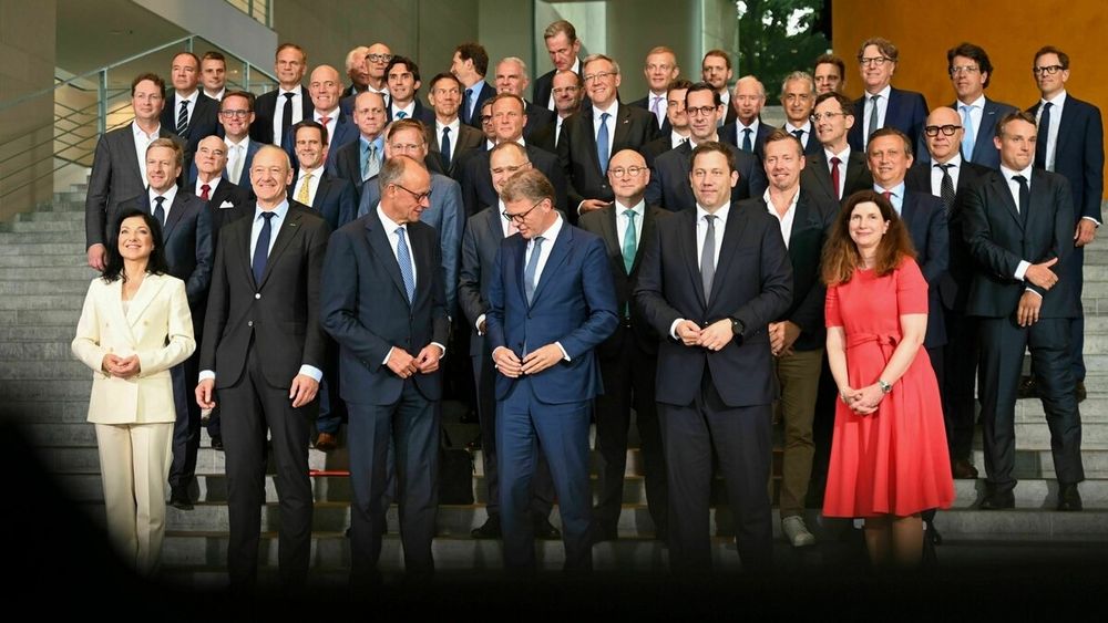 German chancellor Merz surrounded by 43 men and 2 women