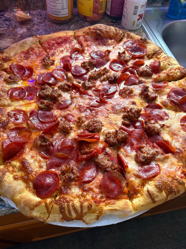 The best looking pizza you’ve ever seen, topped with pepperoni and Italian sausage along with copious amounts of grease
