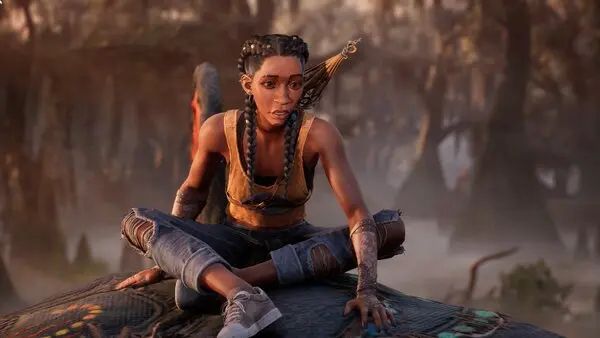 A screenshot of Hazel, the protagonist of South of Midnight, sitting on a rock in a swamp facing the camera. She’s a teenage black girl, with two big braids, ripped jeans, and a yellow tank-top.