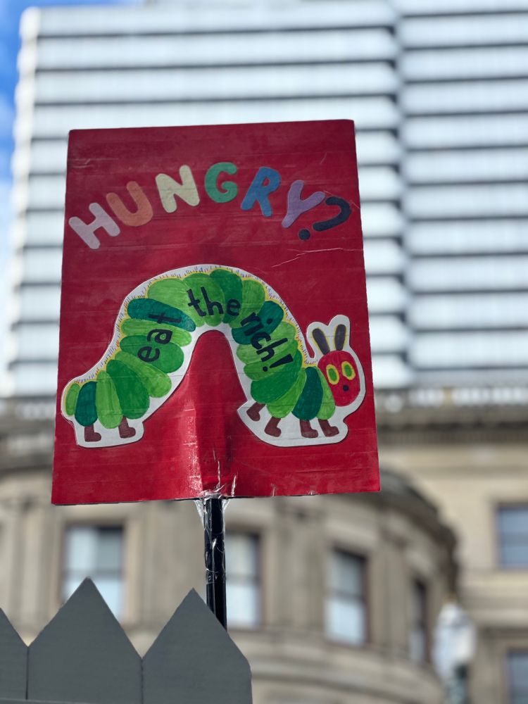 Hungry, hungry caterpillar cover but it says “hungry? Eat the rich”