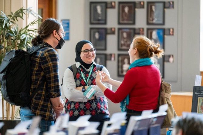 Delegates chatting at the IMC Bookfair.