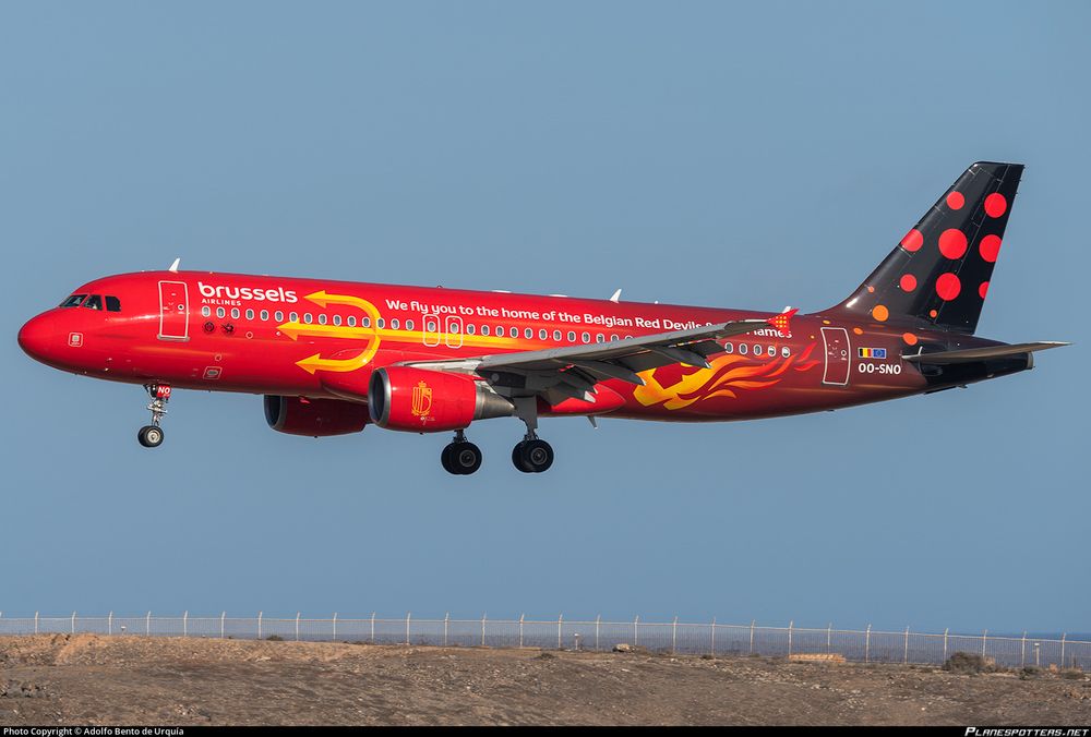 Brussels Airlines Airbus A320 in a red and black gradient livery with a trident along the side advertising the Belgian Red Devils and Red Flames