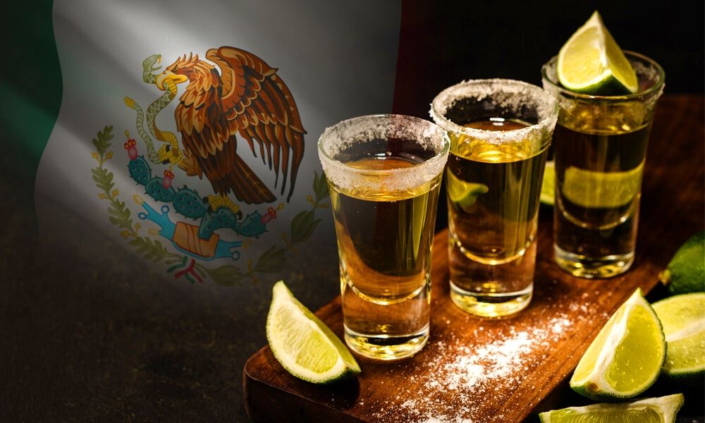 Picture shows tequila shots and the Mexican flag.