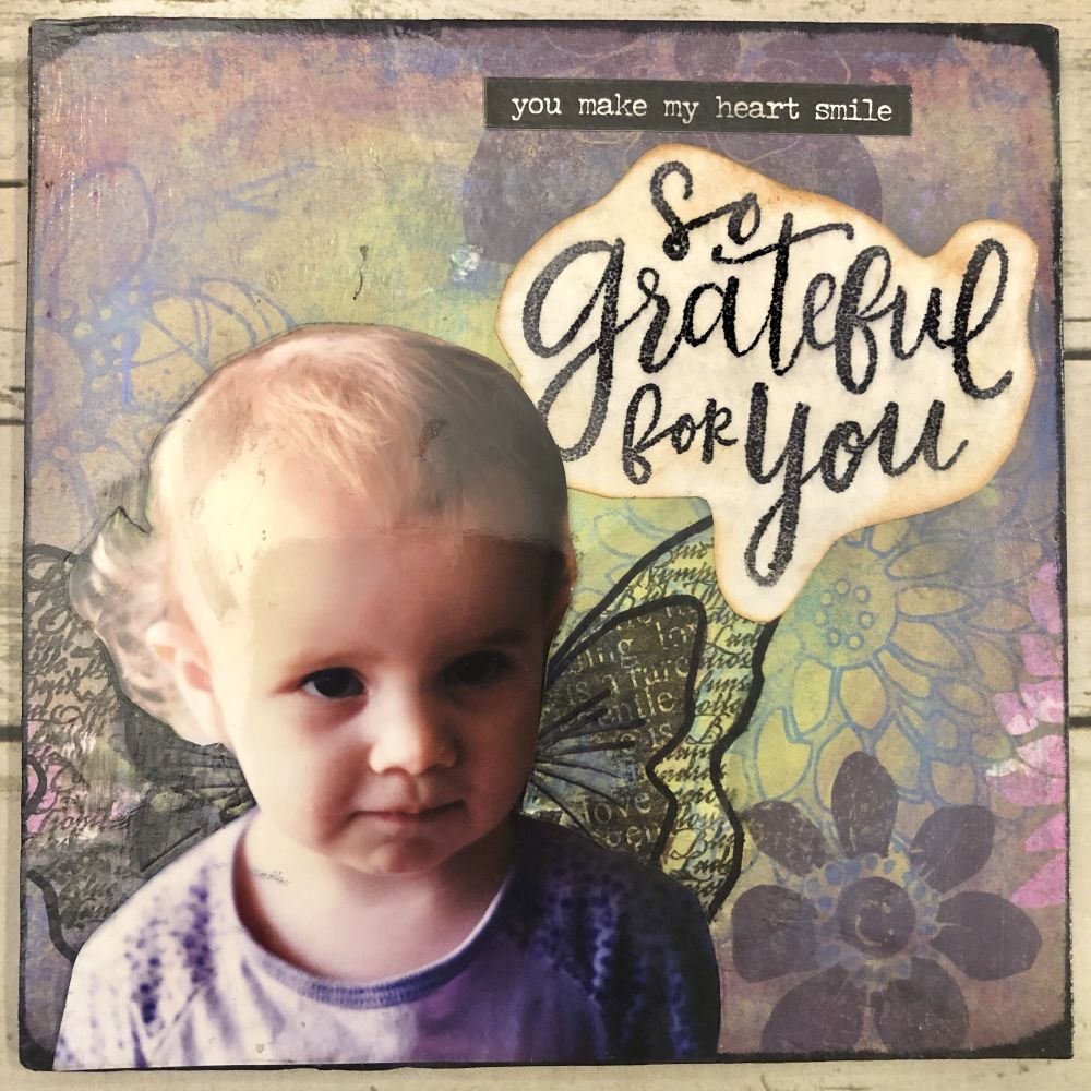 Mixed media collage on wood panel featuring my daughter as a toddler (a long time ago) and inspirational words - “you make my heart smile” and “So grateful for you”. 
