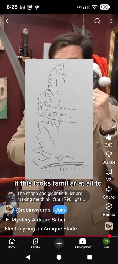 Maker's mark which is half worn off. The visible parts sow some kind of leaves and a scroll with the letters "Warr" visible with additional letters showing but incomplete.