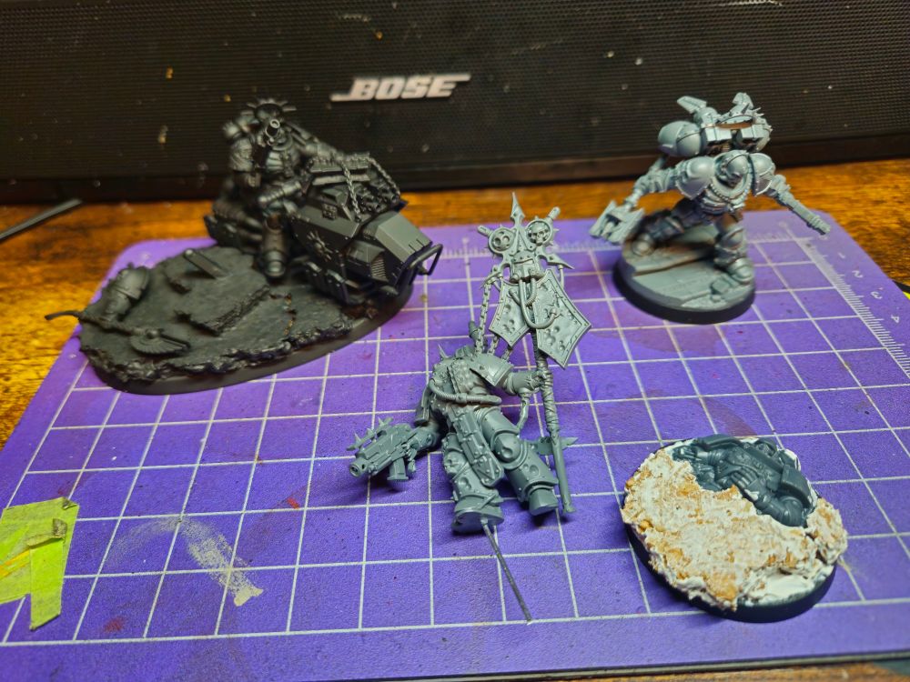 A Chaplain on a Hover Bike, a Death Guard Icon Bearer, and Lemartes of the Blood Angels.