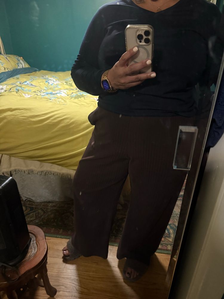 Brown track pants with a navy shirt 