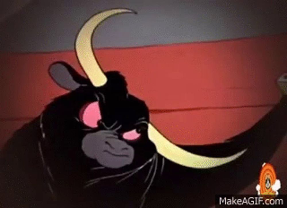 a cartoon bull with long horns is standing on a red carpet and looking at the camera .