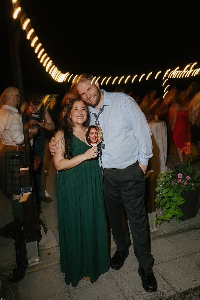 A photo of Dawn and Kyle at Dawn's best friend's wedding near the end of the night. It has some motion blur and was one of the professional photographer's proofs. 