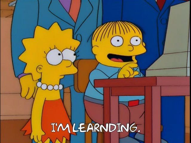 Lisa Simpson and Ralph Wiggum from The Simpsons. Ralph is at the computer. Subtitle reads: I’m Learnding.