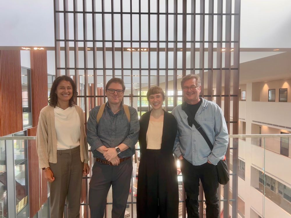 Photo of four philosophers standing in a row: Tony Chemero, Mel Andrews, Zvi Biener, Angela Potochnik