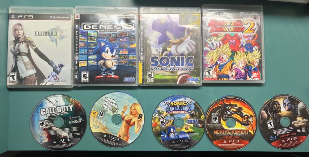 Left-to-Right, Top-to-Bottom: Final Fantasy XIII, Sonic's Ultimate Genesis Collection, Sonic the Hedgehog (2006), Dragon Ball Raging Blast 2, Call of Duty Black Ops, Grand Theft Auto V, Sonic & Sega All-Stars Racing, Mortal Kombat Komplete Edition, Mortal Kombat vs DC Universe