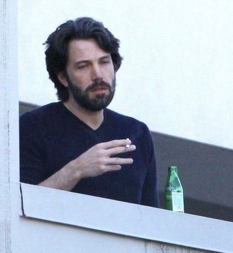 Ben Affleck holding a cigarette looking tired reaction pic