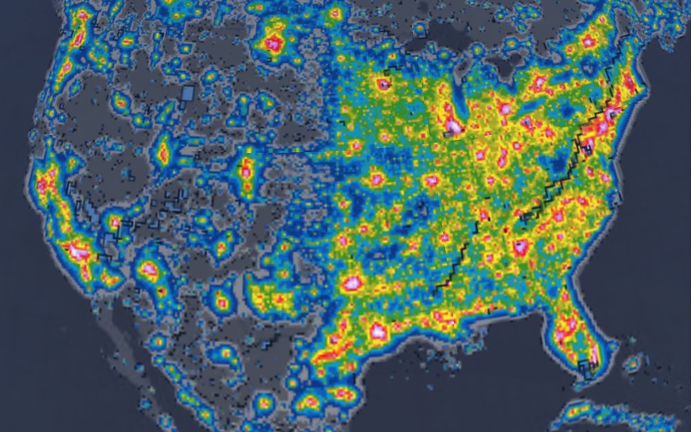 A simulated map of the U.S. showing light pollution throughout. The red areas are where it’s worse and the darker areas have little to no light pollution. It’s worse on the eastern side of the U.S. compared to the western side except for California.