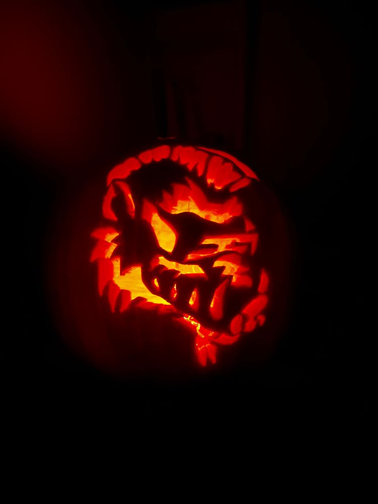 A glowing pumpkin of the head of Bebop from Teenage Mutant Ninja Turtles  