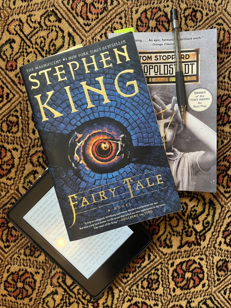 Copies of Stephen King's novel, "Fairy Tale," and Tom Stoppard's play, "Leopoldstadt," along with a Kindle opened to Sayers's mystery, "Unnatural Death." Not pictured, Tolkien's "Fellowship of the Ring," also on Kindle this time through.