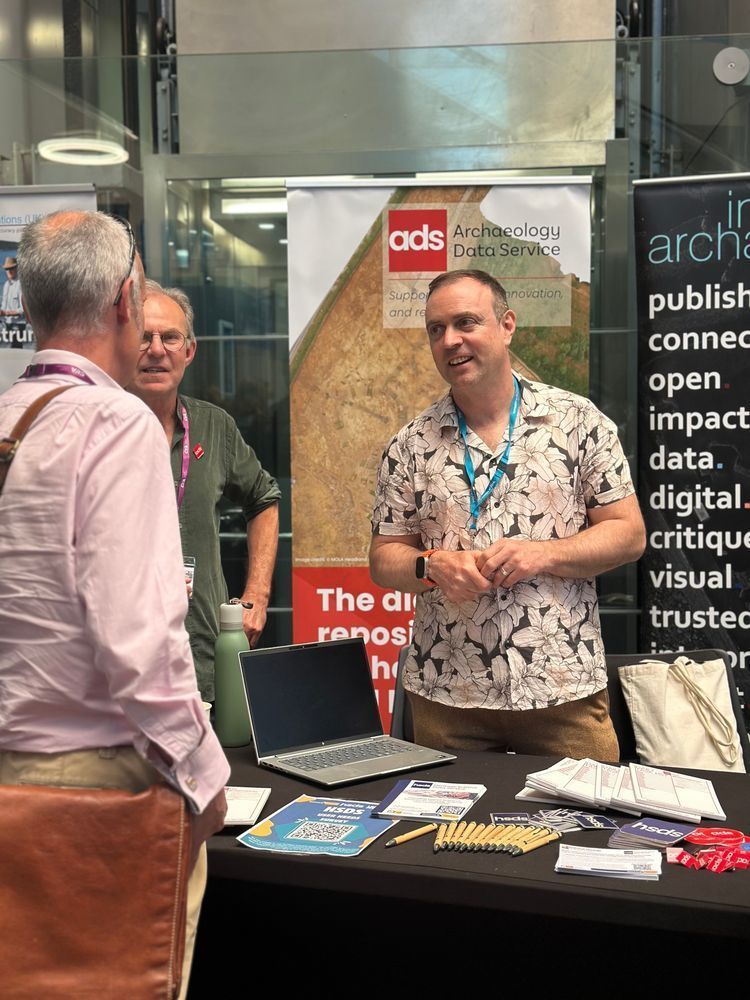ADS and HSDS staff talking to attendees at the stall 
