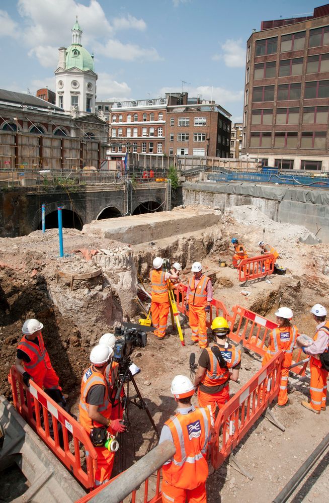 Working shot of archaeologists within a city landscape 