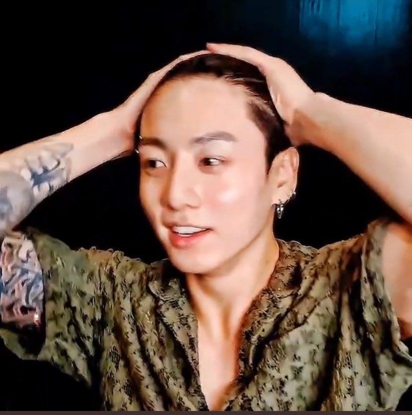 Jungkook during that one Live with the see-through green mesh pajamas.
