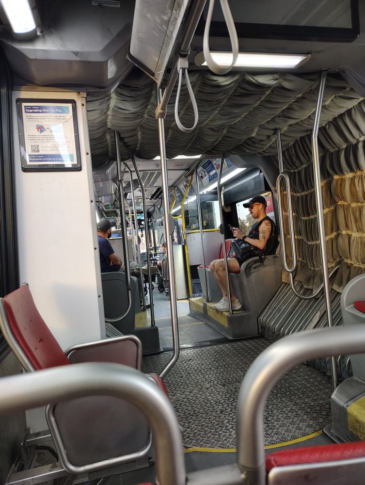 A long bendy bus interior