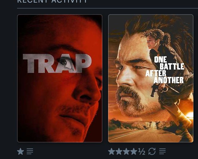 screenshot from Letterboxd of the posters for the movies "Trap" and "One Battle After Another," which feature the faces of Josh Hartnett and Leo Dicaprio facing each other as if about to kiss