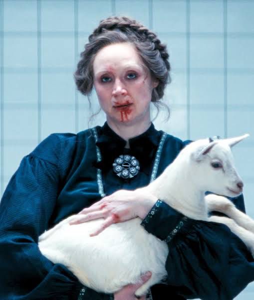 The reference photo of Gwydoline Christie and her goat, from the tv show Severence.