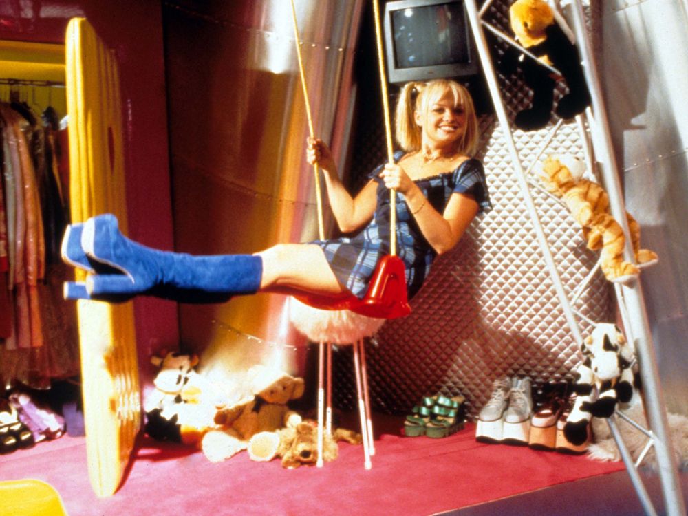 Baby Spice on a swing on the tour bus, rocking amazing blue velvet platform boots, in the movie Spice World.