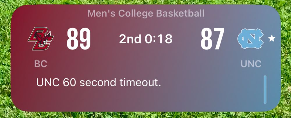 An image showing a notification from Apple’s Sports app for a basketball score with Boston College (BC) leading North Carolina (UNC) 89-87 with 18 seconds remaining in the second half. This information is incorrect; the game has already ended with a 102-96 win for UNC.