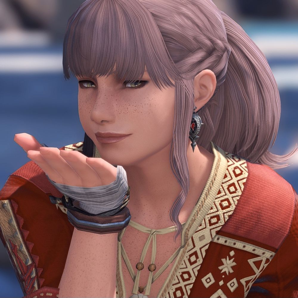 Nayzak is blowing a kiss to the camera. Her cheeks are fuller, nose is larger, and her eyes are less up turned. Her lips are also changed from the un-modded version.