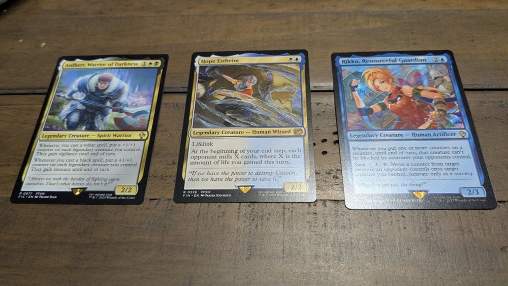 Three Magic The Gathering cards- Ardbert from FFXIV, Hope from XIII and Rikku from X