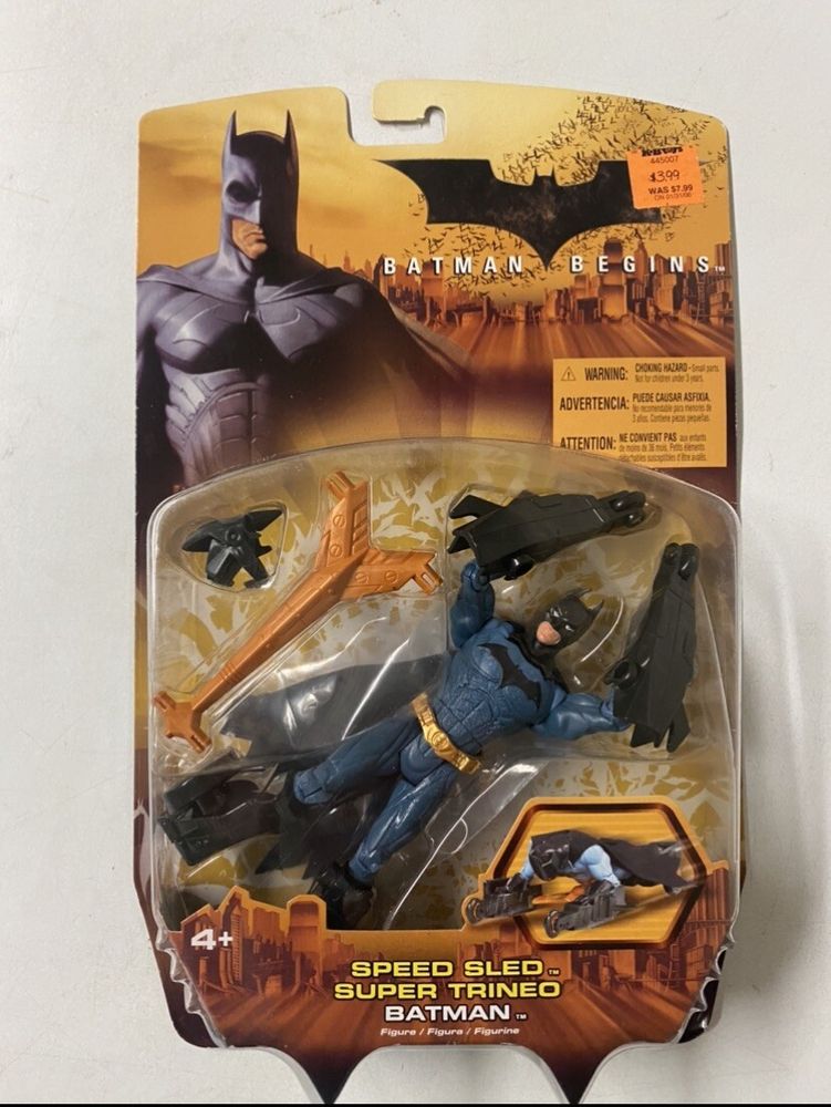 A Batman Begins action figure, Speed Sled Batman. He has wheel attachments on his hands and feet.