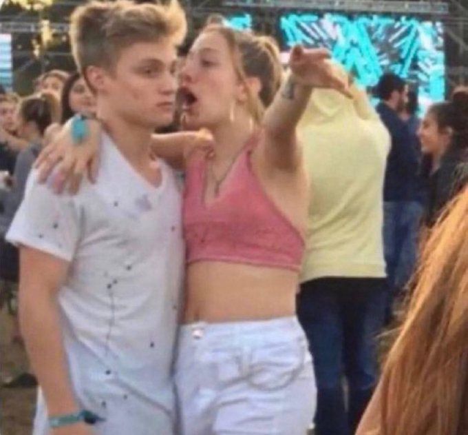 Girl yelling at guy at concert 