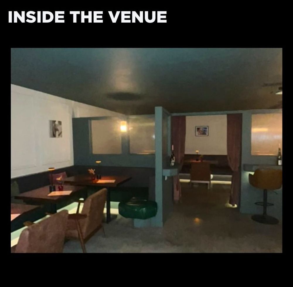 an image inside the venue showing lots of space with tables and chairs. the lighting is low. 
