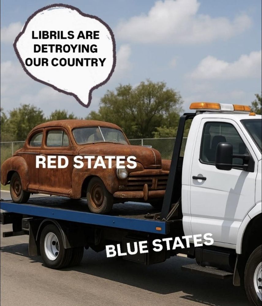 A rusted 1950s styled car on the back of a tow truck. The rusted car is labeled 'red states' and the tow truck is labeled 'blue states'. The rusted truck is loudly declaring 'Librils are destroying our country!'.