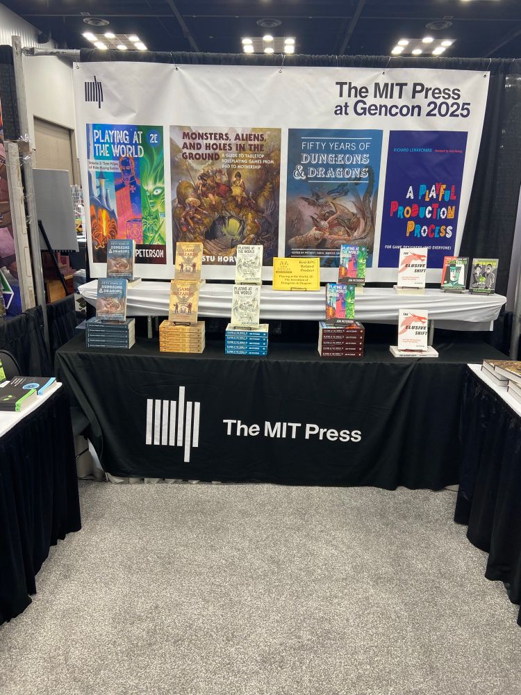 The MiT Press GenCon booth with lots of books set up