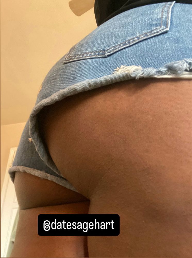 Sage’s asscheeks poking out of their jean shorts