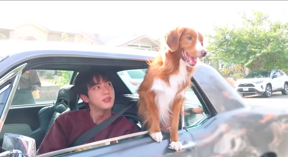Jin and Tango filming Running Wild MV sitting in the Mustang