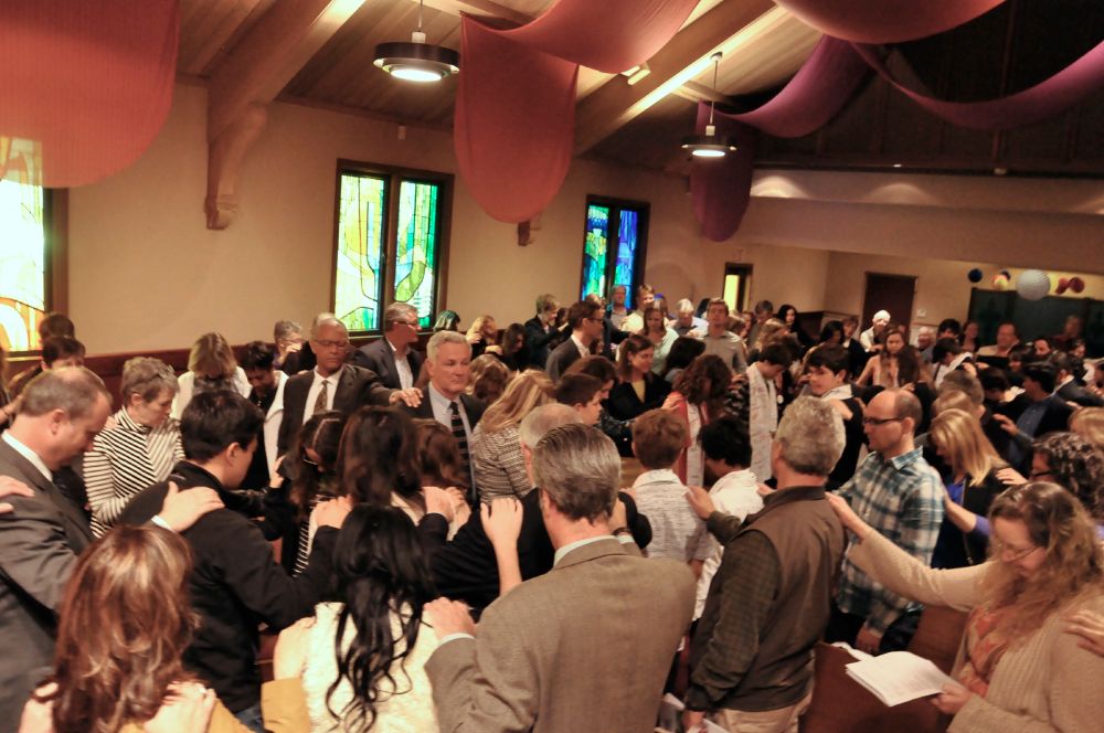 Members of the congregation lay hands in blessing on all those who have graduated from Confirm Not Conform—whether they have chosen to be confirmed or not.