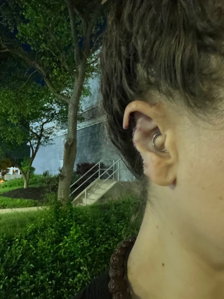 Woman with orc ear body modification