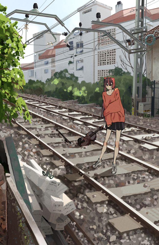 a person standing on the middle of some train tracks with a violin behind