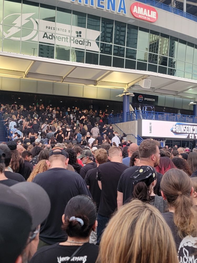 Crowd of concert goers entering to see Ghost