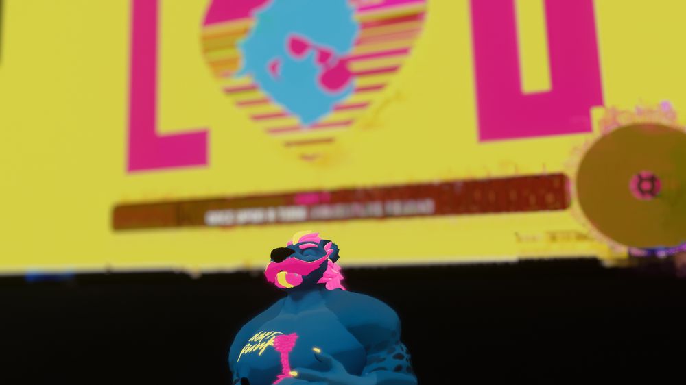A pansexual pride bear yeen standing serenely in front of a screen displaying a DJ video overlay of his logo, displaying "LUV" as the set's tagline. He is happy.