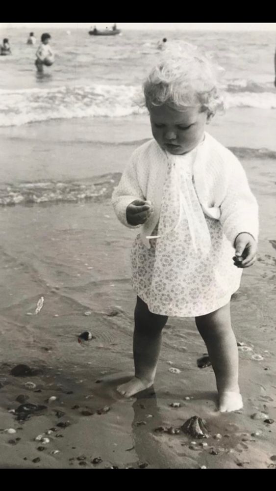 Chubby little toddler contemplating a stone, feet sinking in the wet sand. Nothing much has changed except I’m a bit bigger.
