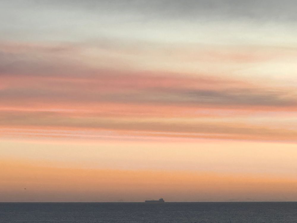 Not sure who painted this but they really know their colour wheel. Striped sky with ship.