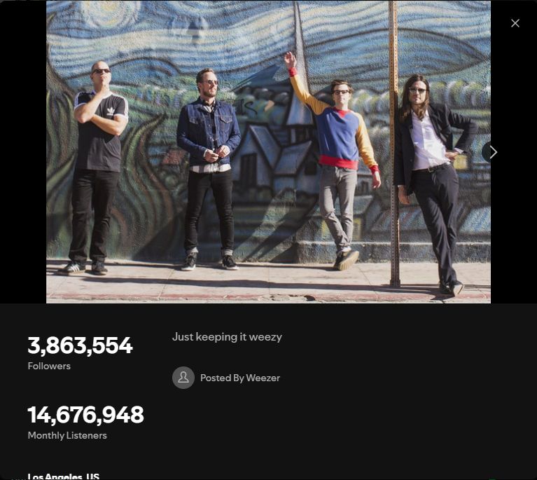 Weezer's Spotify bio, picture of the band on top, with their bio simply saying "Just keeping it weezy"