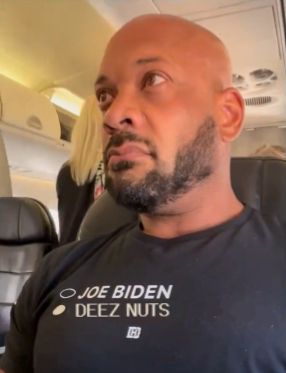 An edit of David J. Harris (the annoying guy who wears MAGA hats on planes) where his shirt has been changed from implying he will vote for a convicted felon over Joe Biden to implying he will vote for Deez Nuts over Joe Biden